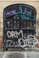 Wooden old door with graffity in Prague