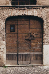Fototapeta na wymiar Wooden old door in Rome, Italy