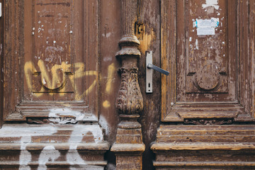 Wooden old door with graffity in Prague
