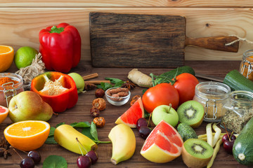 Healthy food, clean food selection:  fruits, vegetables, seeds, spices on wooden background
