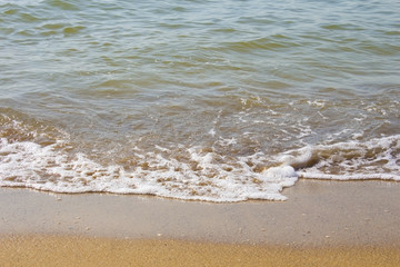 Soft wave of the sea on the sandy beach