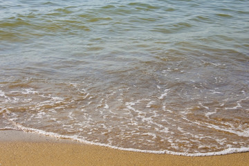 Soft wave of the sea on the sandy beach