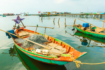 Fototapeta na wymiar Fishing boat in Traditional fishing floating village, Phu Quoc Island in Vietnam