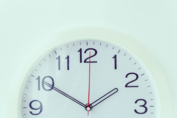 A round clock on light  background, close-up.