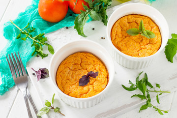Vegetarian vitamin breakfast French baked cheese souffle with tomato  on a wooden table. Vegan dish. Proper nutrition. Healthy lifestyle.
