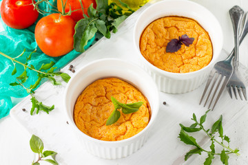 Vegetarian vitamin breakfast French baked cheese souffle with tomato  on a wooden table. Vegan dish. Proper nutrition. Healthy lifestyle.