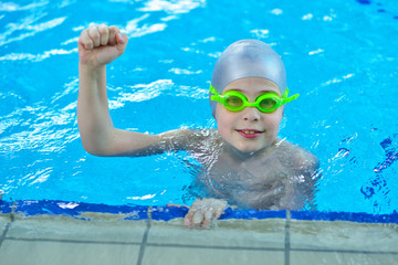 Pretty little girl in swimming pool