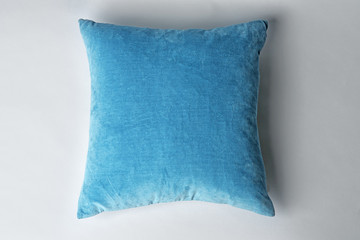 Soft decorative pillow on light background