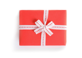 Beautifully wrapped gift box on white background, top view