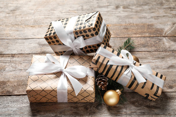 Beautiful composition with gift box and Christmas decorations on wooden table