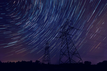 power line silhouette / night sky landscape trace star