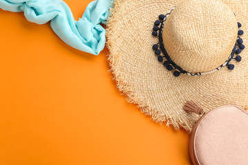 Flat lay composition with stylish summer hat on color background