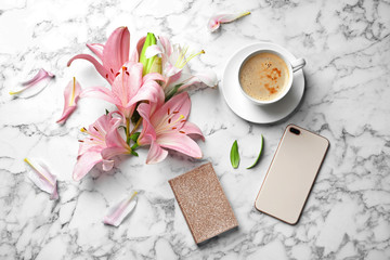 Obraz na płótnie Canvas Flat lay composition with lily flowers, cup of coffee and smartphone on marble background