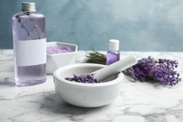 Composition with lavender flowers and natural cosmetic on table