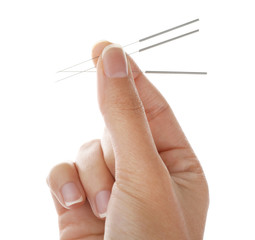 Woman holding needles for acupuncture on white background - obrazy, fototapety, plakaty