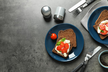 Flat lay composition with toast bread and tableware on grey background