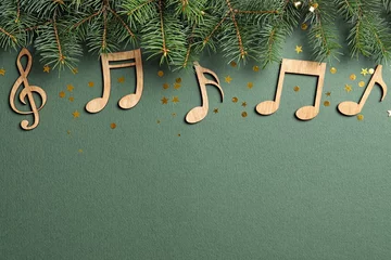 Foto op Aluminium Flat lay composition with fir tree branches and notes on color background. Christmas music concept © New Africa