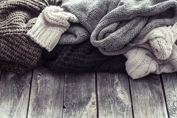 Fototapeta na wymiar Knitted sweater on a wooden background