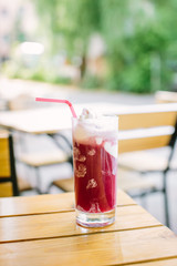 Raspberry ice cream on a wooden table