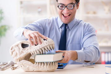 Funny crazy professor studying dinosaur skeleton