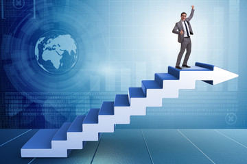 Businessman climbing career ladder in business concept