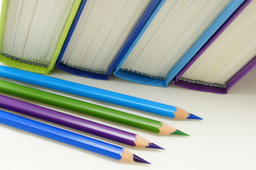 Books and crayons in cool colors.