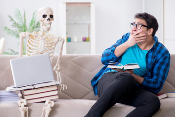 Student studying with skeleton preparing for exams