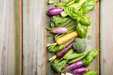 Healthy food concept background. Fresh raw vegetables on old wooden table. Top view and flat lay with copy space.