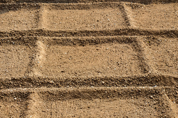 Plowed field with  traces in view
