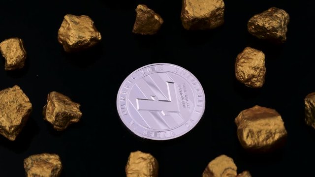 Silver Litecoin with pieces of gold isolated on the black background