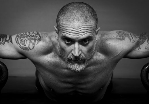 Close up of a 50 Y man doing physical exercise.