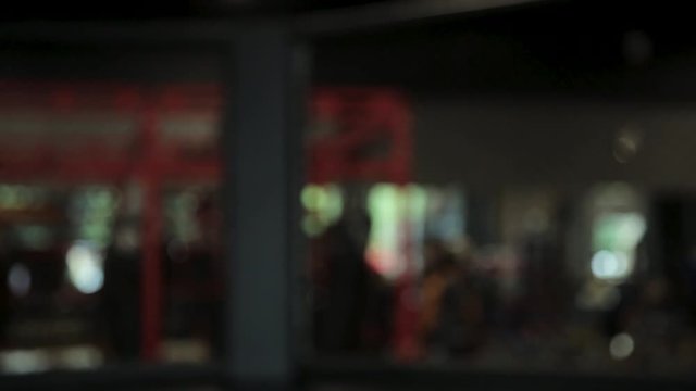 Man doing push-ups in gym, looking into camera, close-up