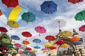 Colorful umbrellas in front of the entrance to the Potocki Palace, Lviv, Ukraine