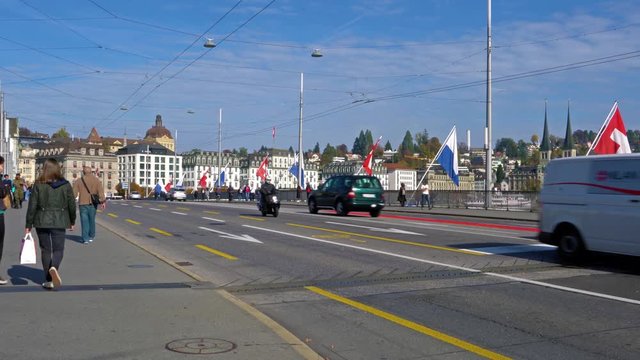 Buses and cars on the city road and old houses, Lucerne, Switzerland