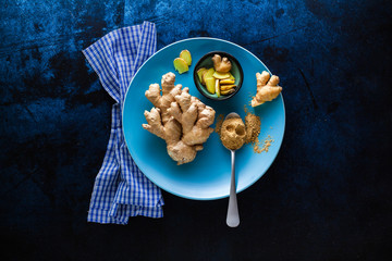roots of ginger and powder from it. healthy natural supplements, spices for cooking