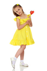Little girl with a candy on a stick