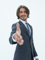 Smiling friendly businessman offers a handshake