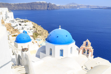 Fototapeta na wymiar Beautiful Blue domed chuch in Oia village, Santorini island, Greece