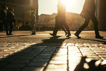 People going to office walking on busy street