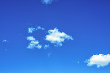 Fluffy white clouds on background of blue sky wallpaper