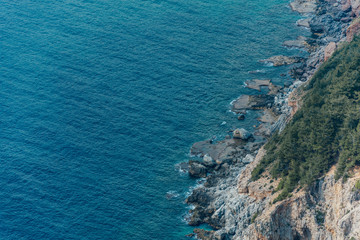 View of the beach Cleopatra. Alanya, Turkey.Wonderful country.Mediterranean sea.Steep rock.Rugged cliff.Mountains and the sea.Vacation at sea.