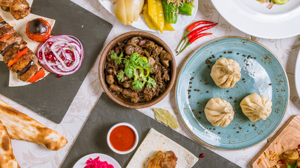 Georgian cuisine foodset from khachapuri, khinkali, pkhali, dolma, satsivi top view
