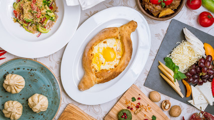 Georgian cuisine foodset from khachapuri, khinkali, pkhali, dolma, satsivi top view