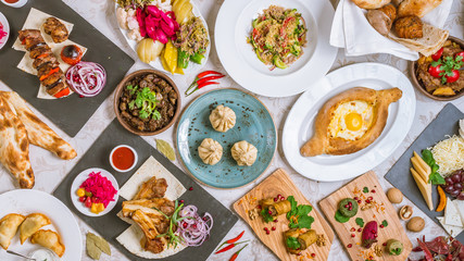 Georgian cuisine foodset from khachapuri, khinkali, pkhali, dolma, satsivi top view