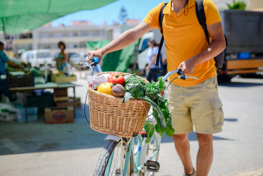 People buying fruits and vegetables. Summer outdoors farm market shopping background. Real purchasing selling natural healthy lifestyle candid closeup image