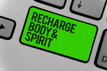 Conceptual hand writing showing Recharge BodyandSpirit. Business photo showcasing fill your energy through relaxation and having fun Computer program keyboard typing office work input device.