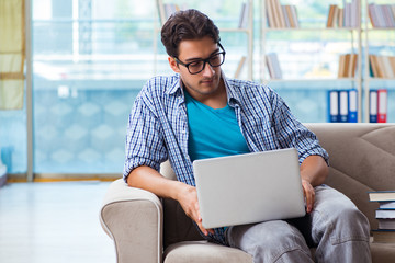 Caucasian student with laptop preparing for university exams