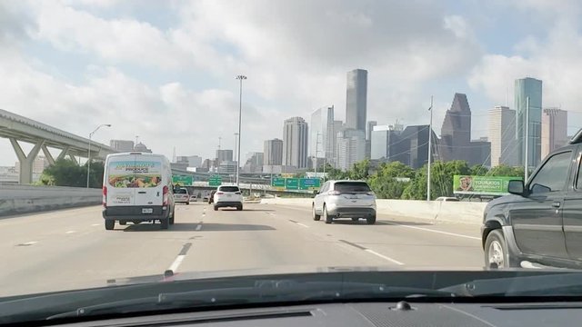 This video is of a car traveling on I-45 during the morning on a Saturday towards Downtown Houston Texas in light traffic. Flat color profile and in slow motion to allow users preferred edits.