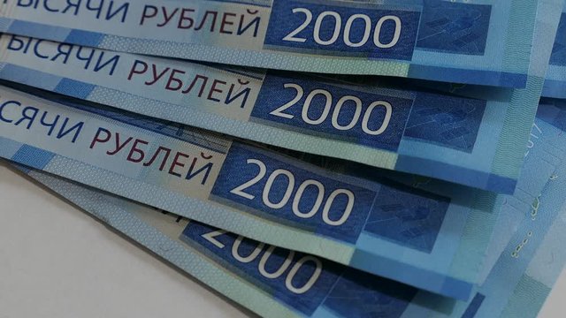 Man Counting Banknotes Two Thousand Rubles