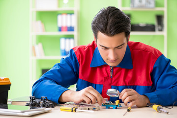 Computer engineer repairing broken desktop